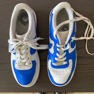 Gently used Nike Air Force 1 sneakers. Custom paint job over white on white.